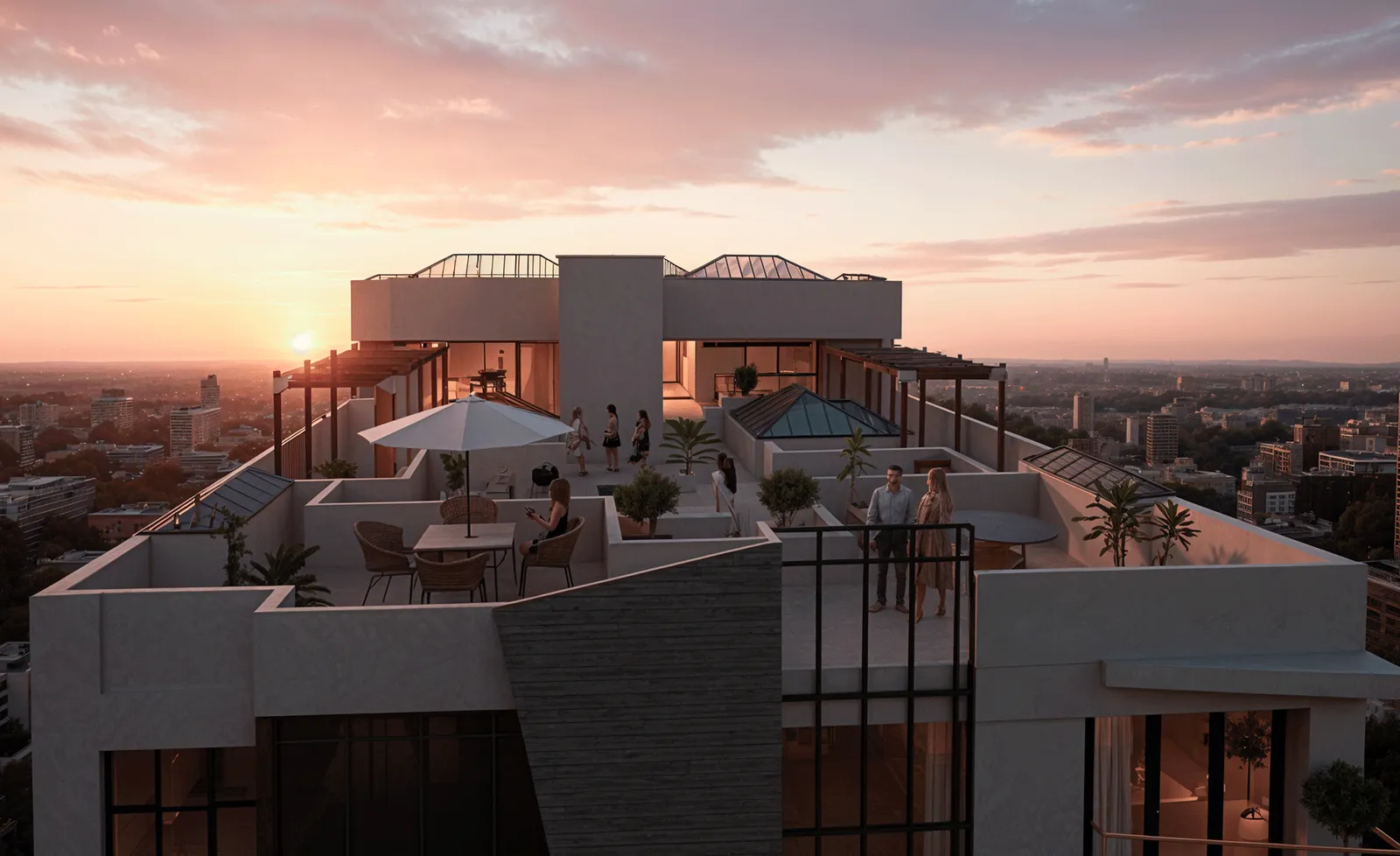 Terraza común en la azotea de Origen Residencial al atardecer con vista panorámica